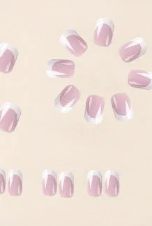24 white false nail tips with a black and white plaid pattern, arranged on a card.