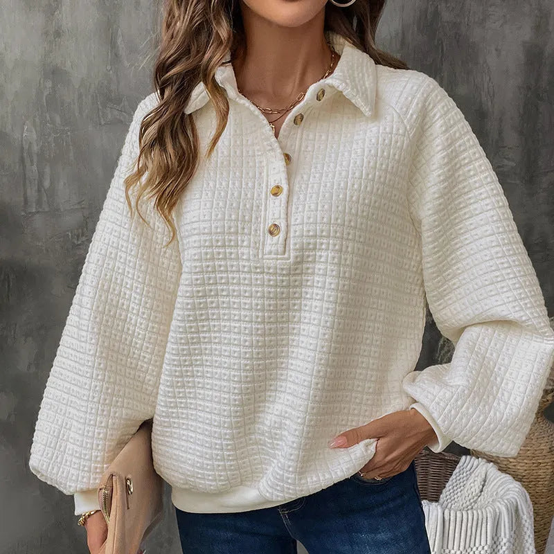 Women's beige polo collar pullover sweater with long sleeves, laid flat.