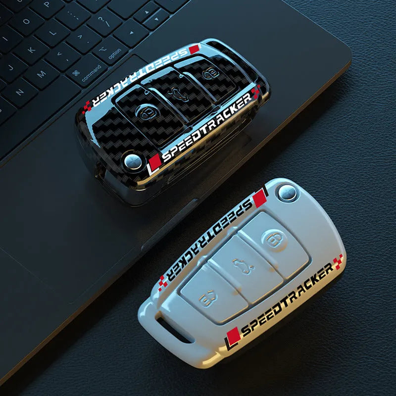 Carbon fibre style car key cover with mirror element in carbon black and white colours