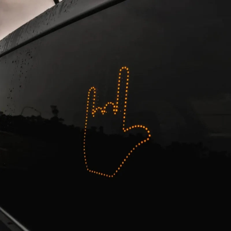Black plastic LED illuminated gesture hand sign light for cars with remote control