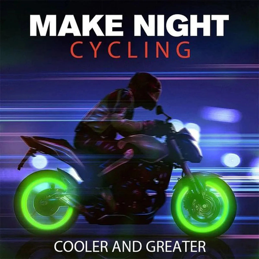 Set of luminous green rubber tyre valve caps on a car wheel valve stem, glowing in low light.