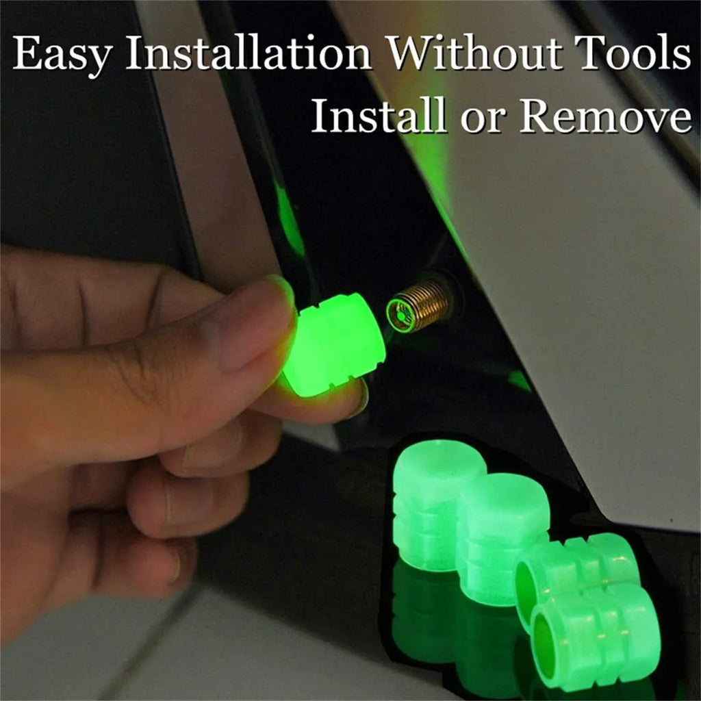 Set of luminous green rubber tyre valve caps on a car wheel valve stem, glowing in low light.