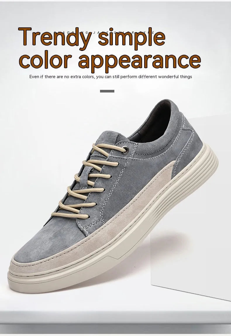 Grey and sand coloured low-top casual skate shoes with pigskin leather upper and rubber sole.