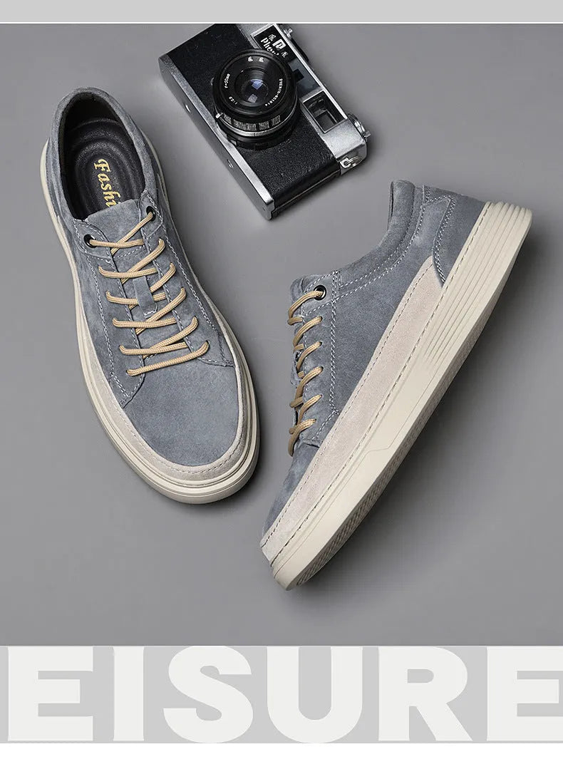 Grey and sand coloured low-top casual skate shoes with pigskin leather upper and rubber sole.