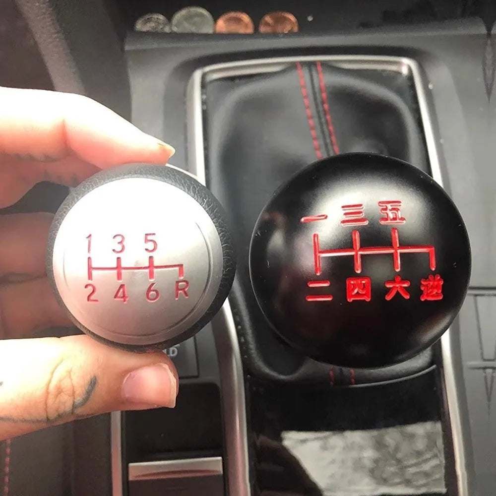 Round aluminium alloy car gear shift head shown in one of five available colour finishes.