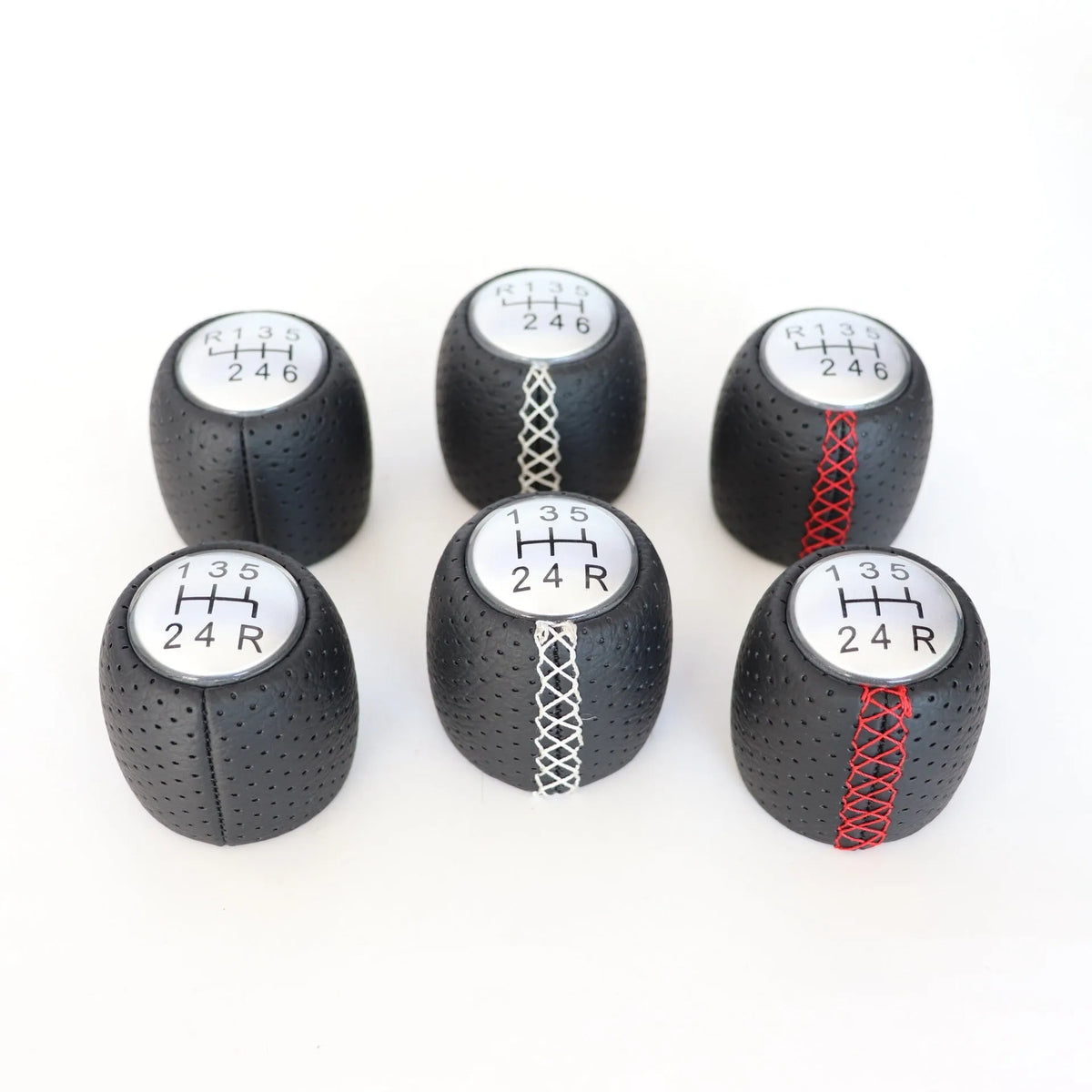 Black perforated leather-style gear shift knob for Alpha car on a 5-speed pattern matte cover.