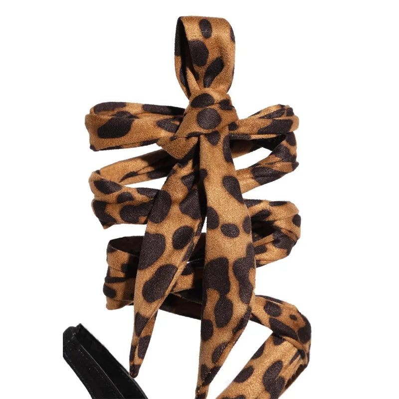 Light brown women's high heels with leopard print and cross straps on an 8cm stiletto heel
