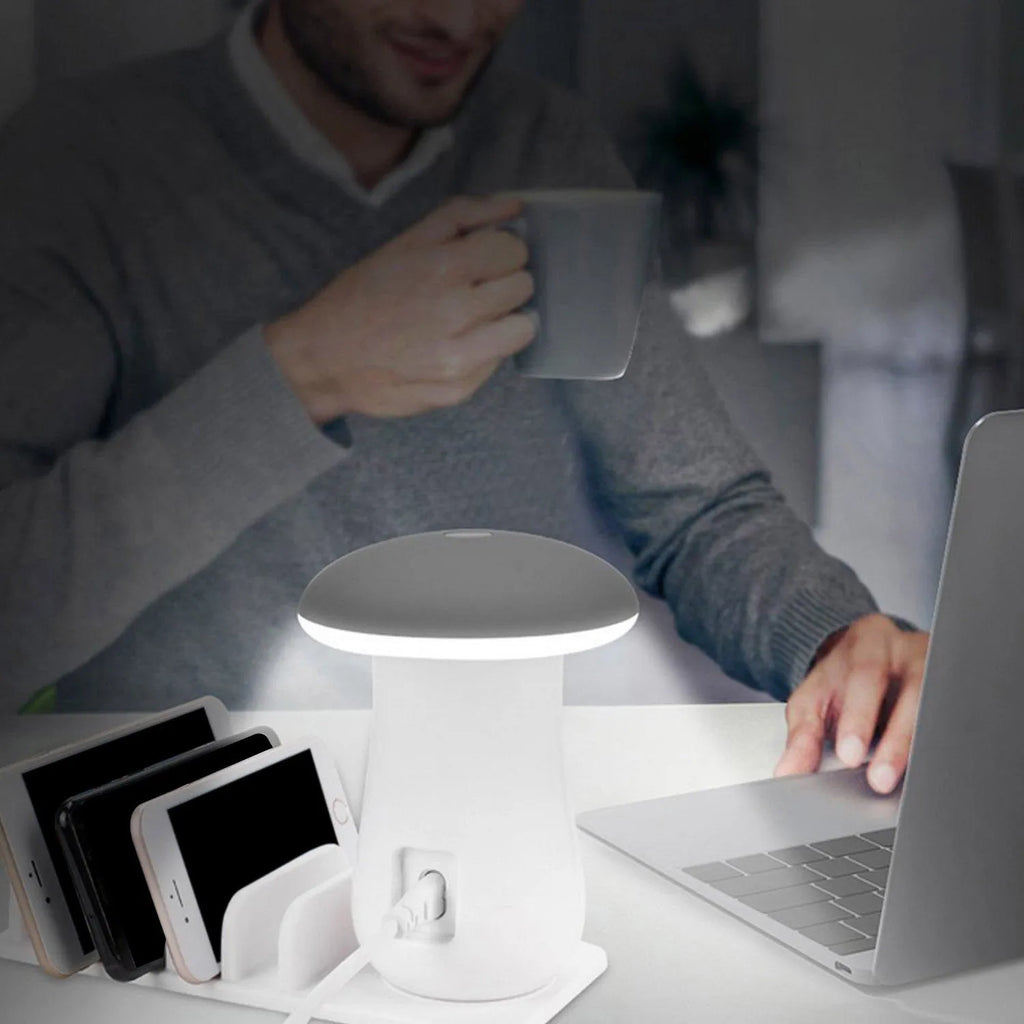 White USB charging station with five ports and built-in LED night light on wooden desk