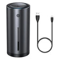 Black aluminium alloy car diffuser humidifier with USB cable on a car dashboard
