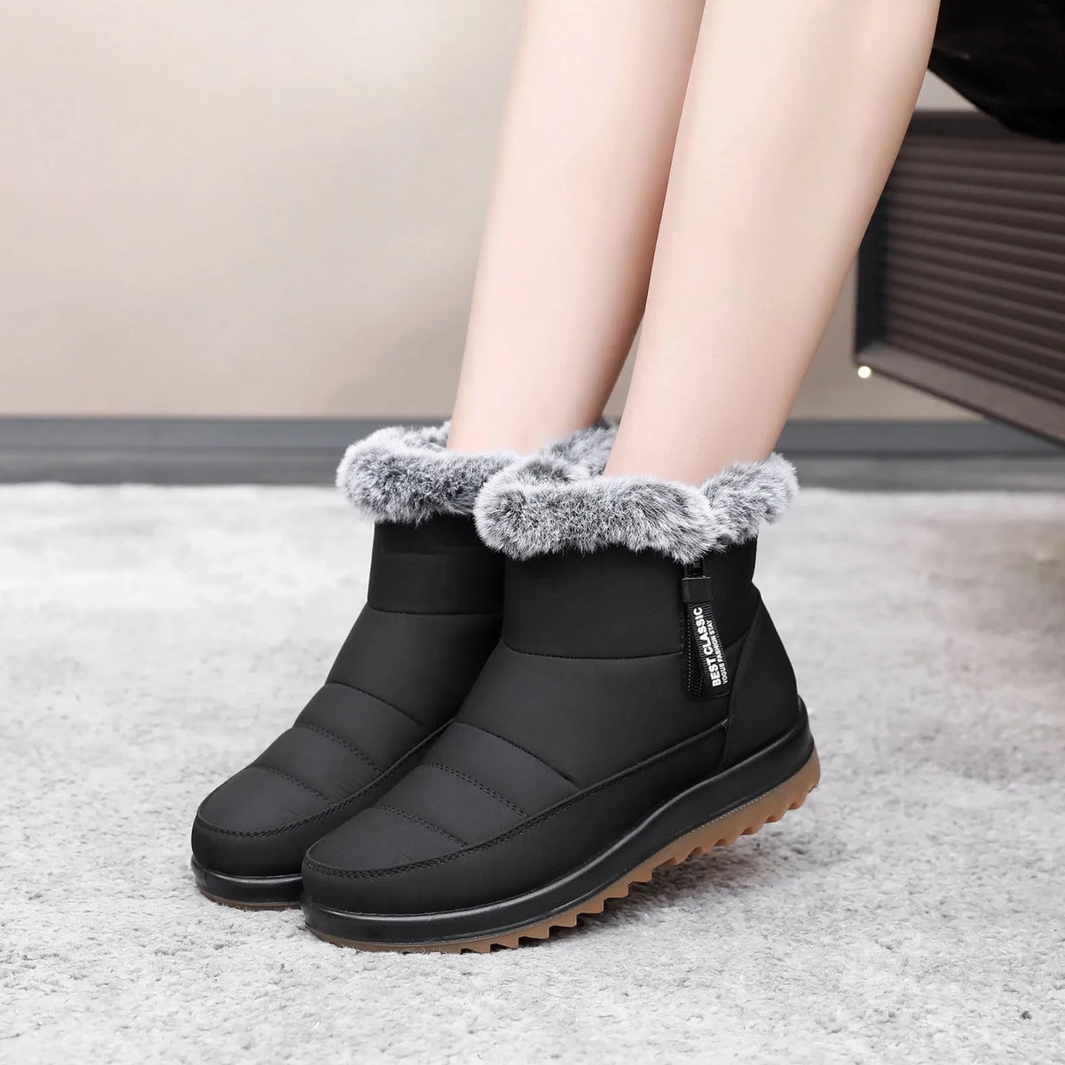 Women's winter ankle boot with side zipper and fleece lining, shown in black, dark brown, and red.