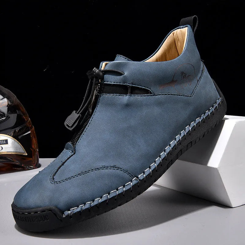 Men's casual leather shoe in green with round toe, mid-heel, and visible sewing thread detail.