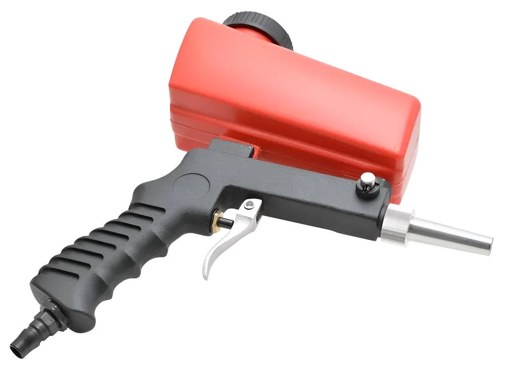 Portable black pneumatic sandblasting gun with top-mounted tank and spray nozzle.