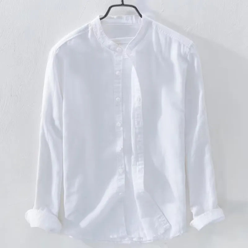 Man's loose fitting long sleeve linen shirt in a solid colour on a hanger.