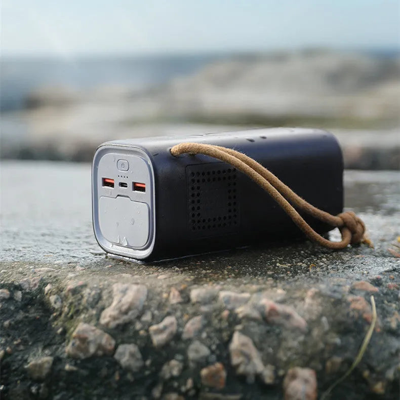 Black portable power bank with solar charging panel, 200W output capacity for outdoor emergency power supply