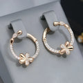 A pair of women's round silver hoop earrings made from electroplated copper.