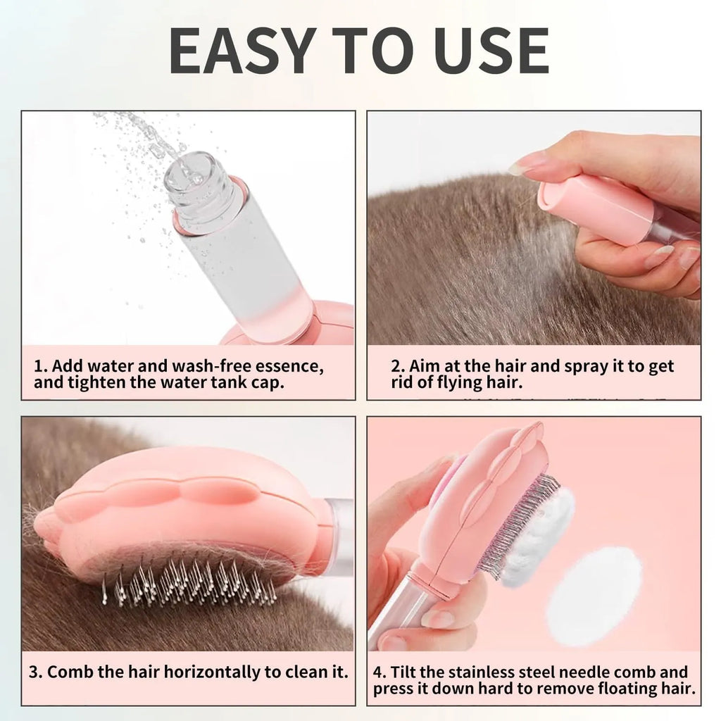 Grey, green, and pink spray cat brush with a release button and curved stainless steel bristles.