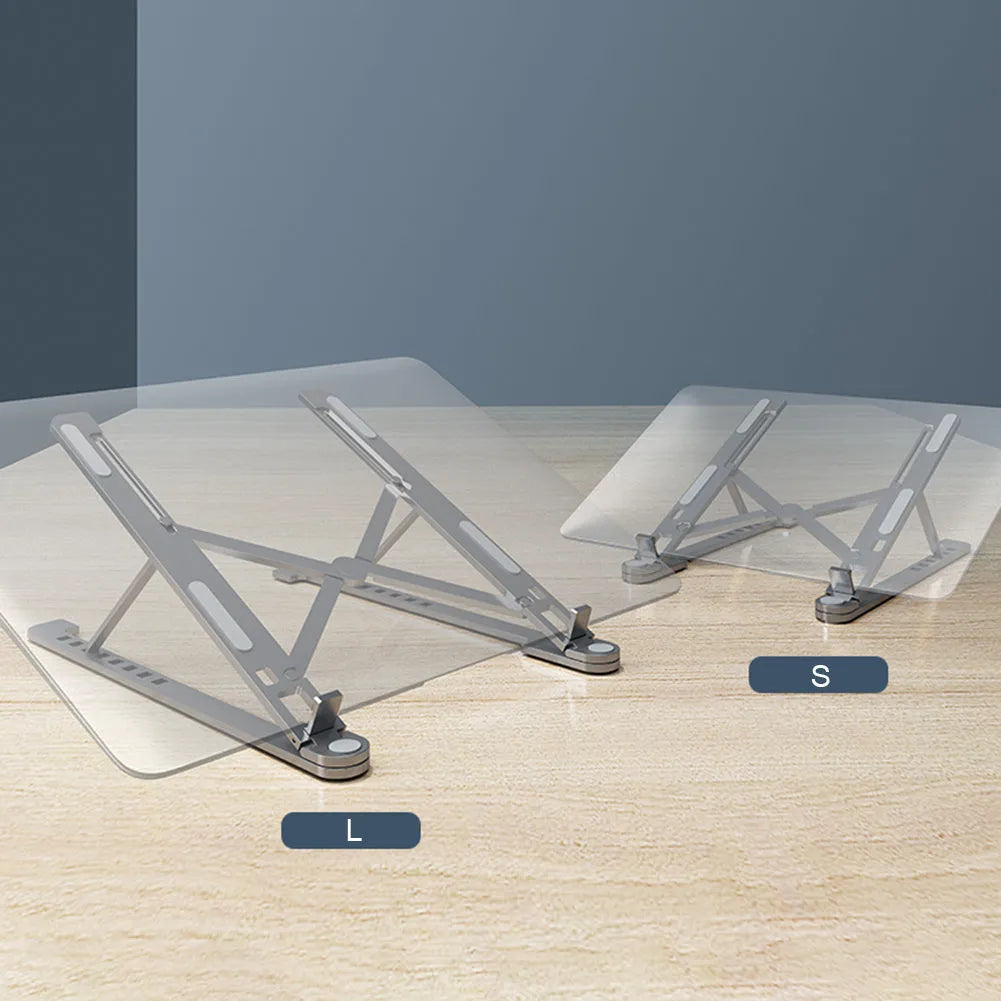 Aluminum alloy laptop stand in silver colour, folded to show its slim profile next to a 15-inch laptop.