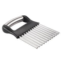 Stainless steel potato wave knife with wavy cutting blade on a chopping board.