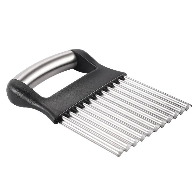 Stainless steel potato wave knife with wavy cutting blade on a chopping board.