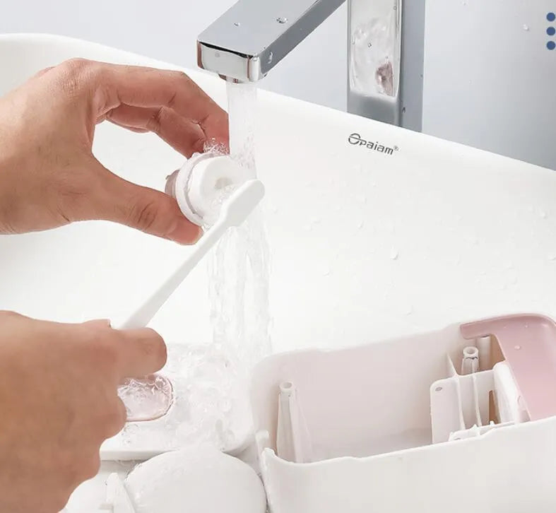 Automatic wall-mounted toothpaste dispenser in blue, grey, or pink colours with LED display