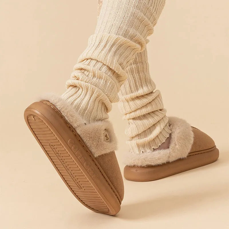 Plush fleece indoor slipper with PVC sole shown in available colours: black, blue, brown, khaki, pink.