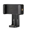 Black plastic phone holder with a rotating clamp on a flat surface.