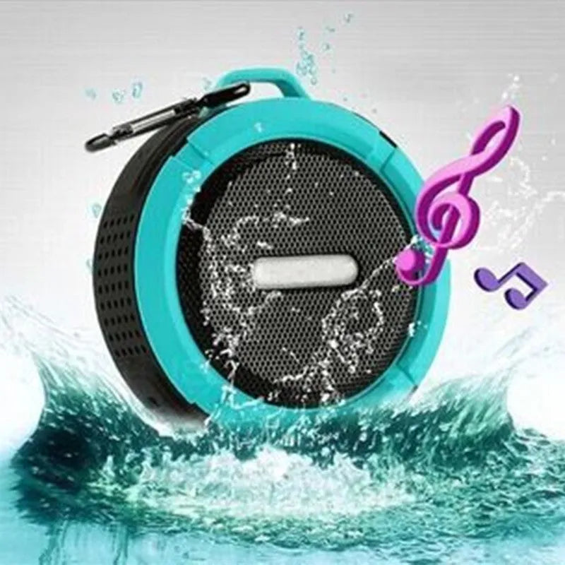 Portable waterproof Bluetooth speaker in multiple colours with a built-in carabiner clip for bags.