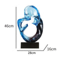 Transparent blue resin modern ornament on a wooden surface.