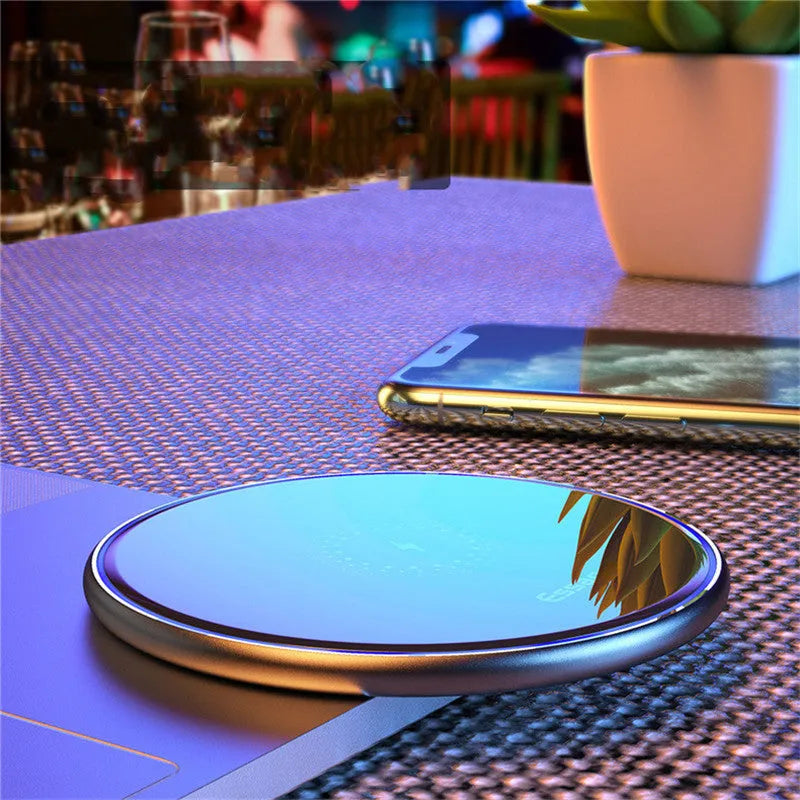 Black 15W fast wireless charging pad with anti-slip surface and LED light, measuring 10.1cm by 7cm