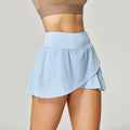 Women's solid colour quick-dry sports shorts in nylon with spandex lining, shown in multiple colours.