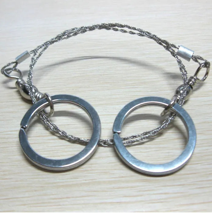 Stainless steel survival wire saw with pull rings showing 55cm cutting length
