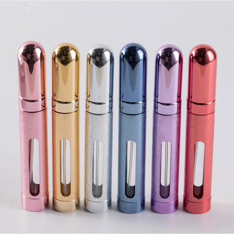 Slim 12ml aluminium travel perfume bottle with glass liner in choice of six colours including blue, gold, and pink.