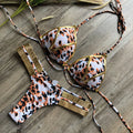 Women's bronzing bikini swimsuit in nylon with chest pad, shown in multiple colour and print options.