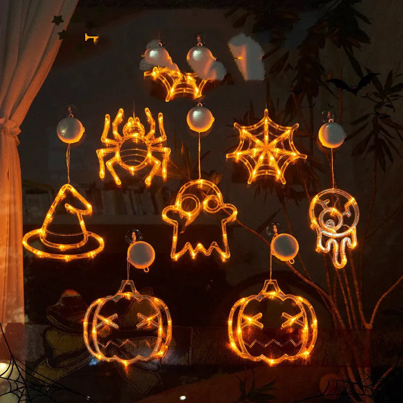Halloween battery-powered LED window lights with suction cups showing spider, pumpkin and ghost designs