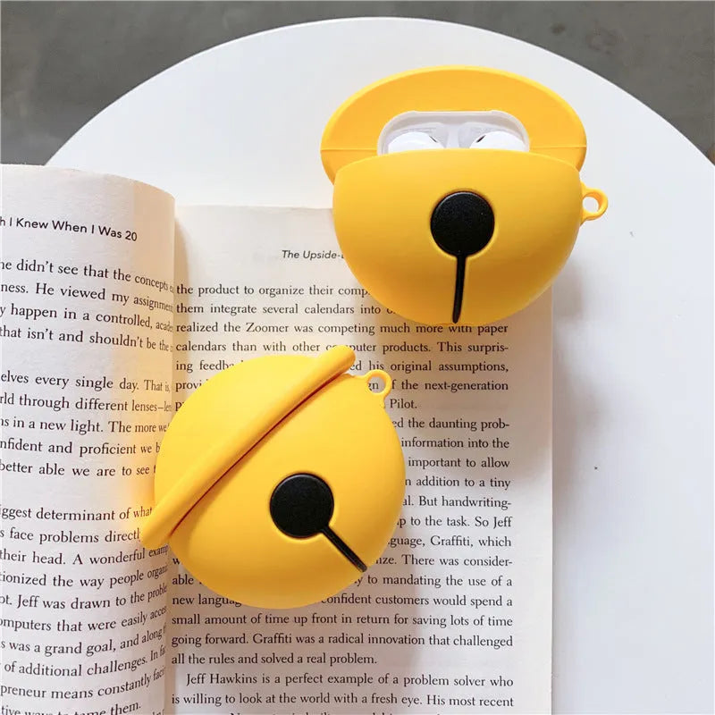 Yellow silicone case with a bell charm and keyring for Apple AirPods 1 and 2 generation.