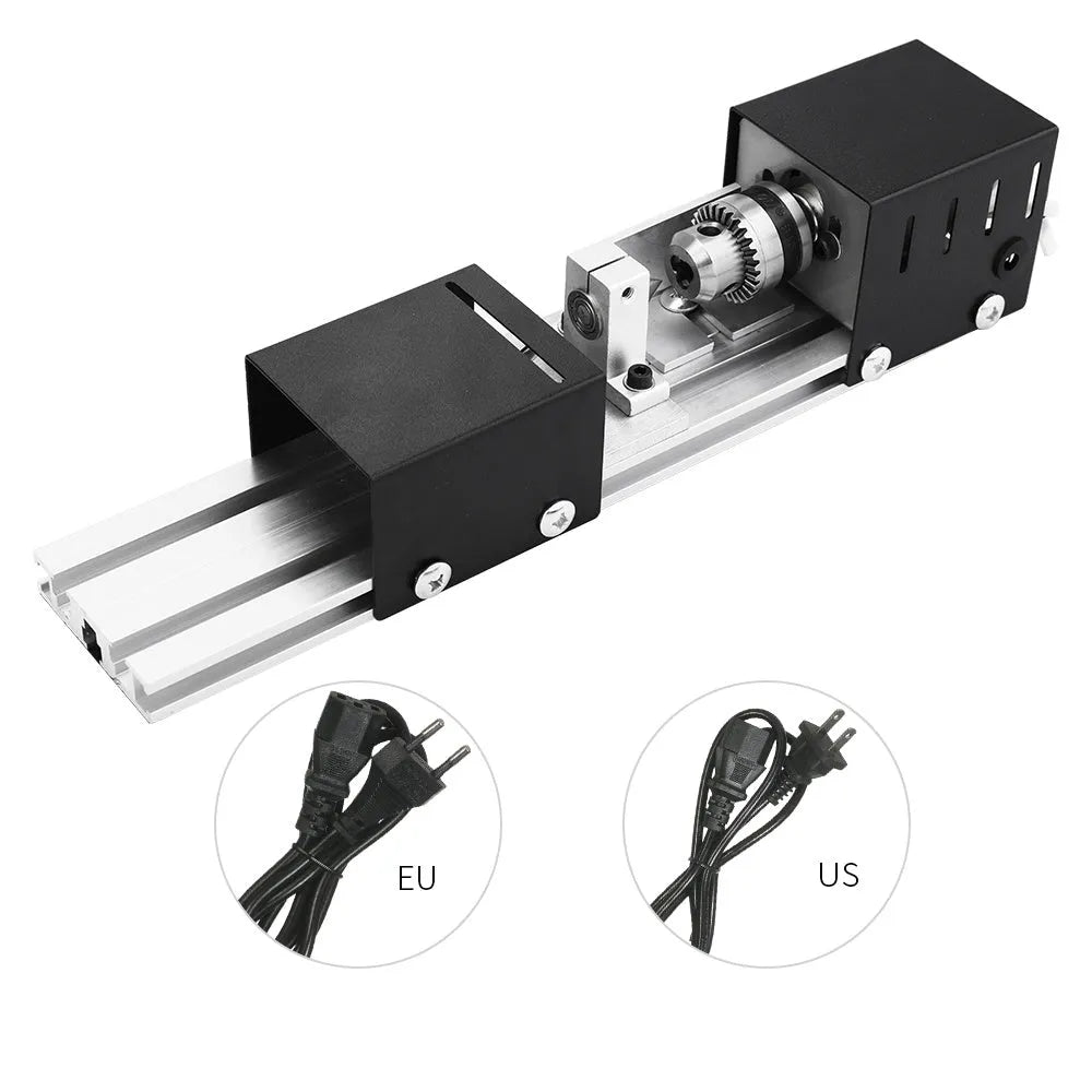 Silver metal mini manual woodworking lathe on a benchtop with carving tools