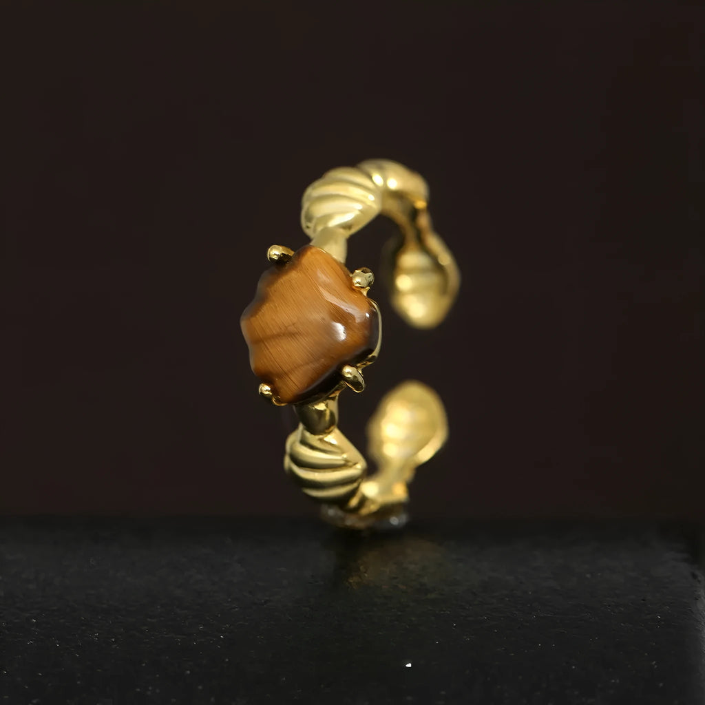 Adjustable silver ring with shell decoration and tiger eye stone on adjustable band