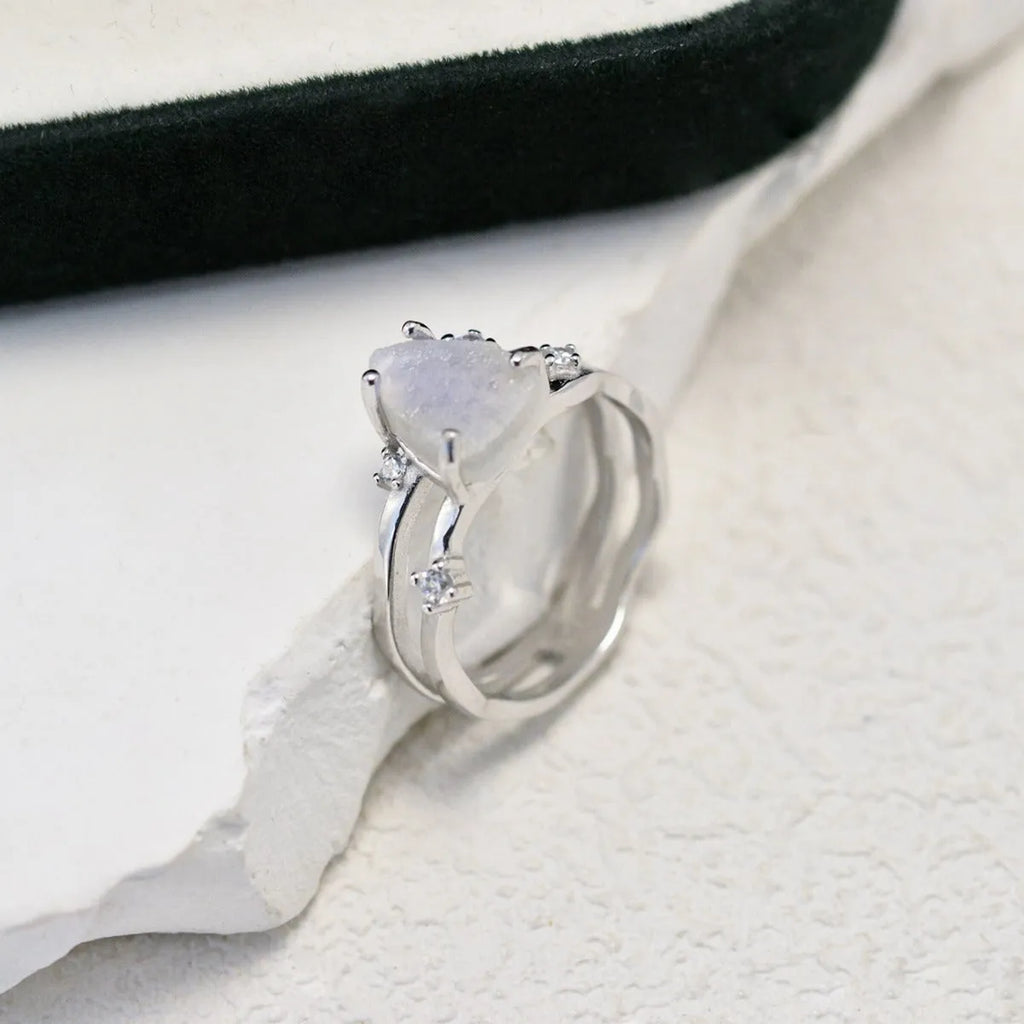S925 sterling silver ring with triangular geometric design and central moonstone in gold tone plating