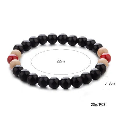 Natural stone lava bead bracelet with charms measuring 18cm in ethnic style