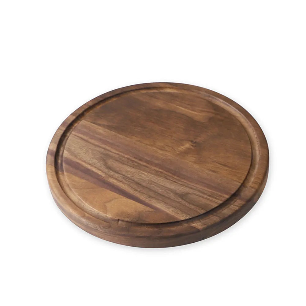 Black walnut wood cutting board with juice groove and side handle, shown in round and rectangular sizes.