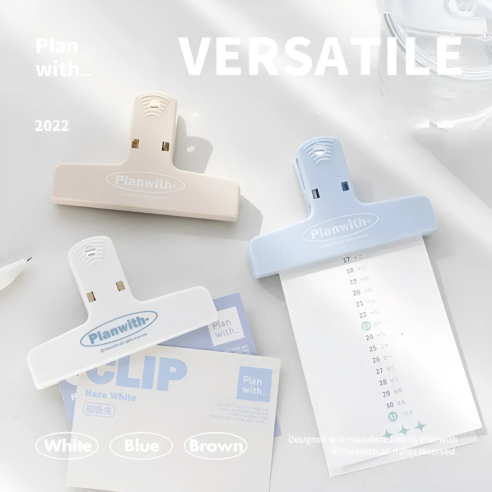 RosyPosy Haze Series blue magnetic bill clip holding receipts on a refrigerator.