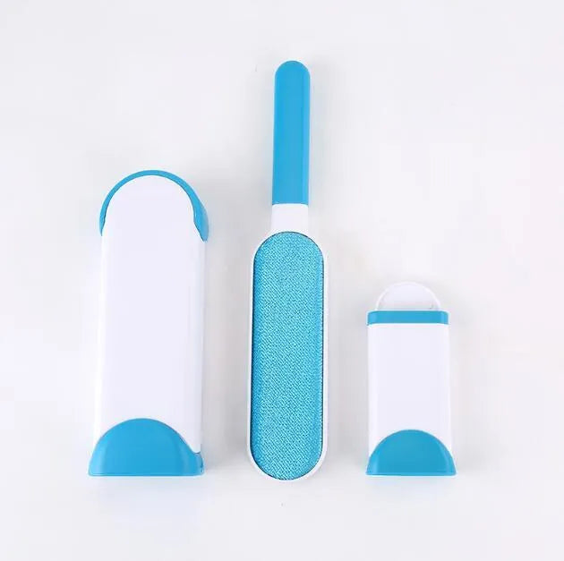 Blue reusable pet hair removal brush with double-sided sticky head placed on its self-cleaning base.