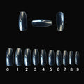 500 clear and natural ABS acrylic false nails in 10 sizes spread on a table