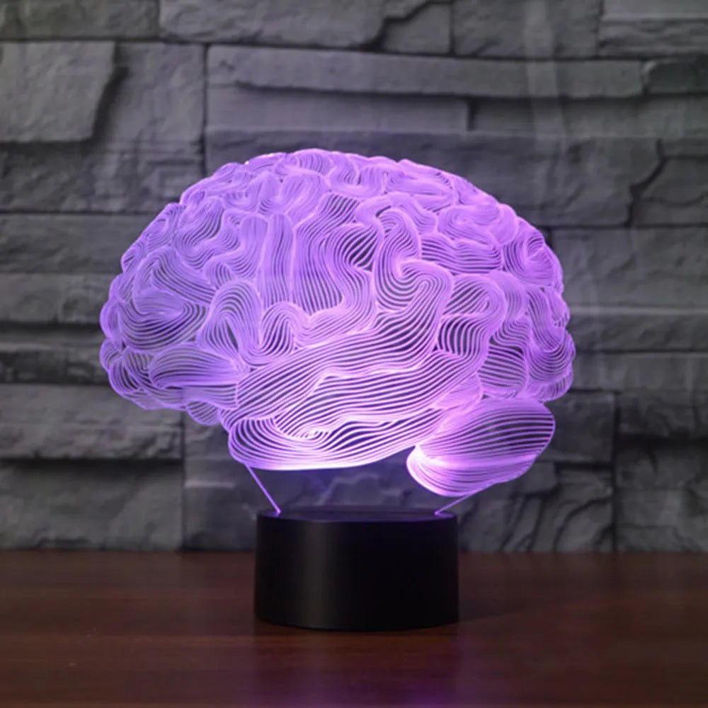 3D acrylic illusion desk lamp with colour-changing LEDs and a black ABS base on a wooden surface.