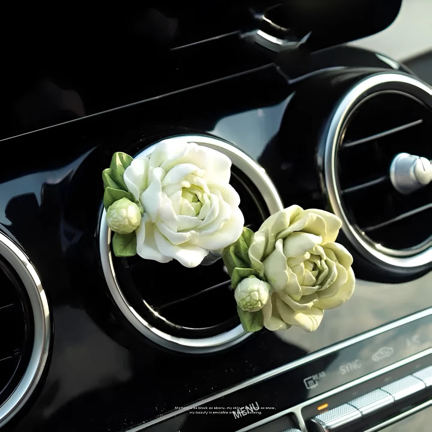 Jasmine-scented car air freshener with gypsum base clipped to vehicle vent