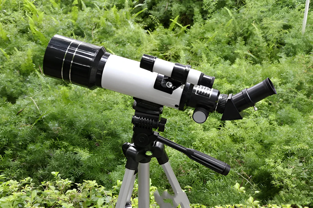 Dark blue monocular astronomical telescope on tripod for children's stargazing