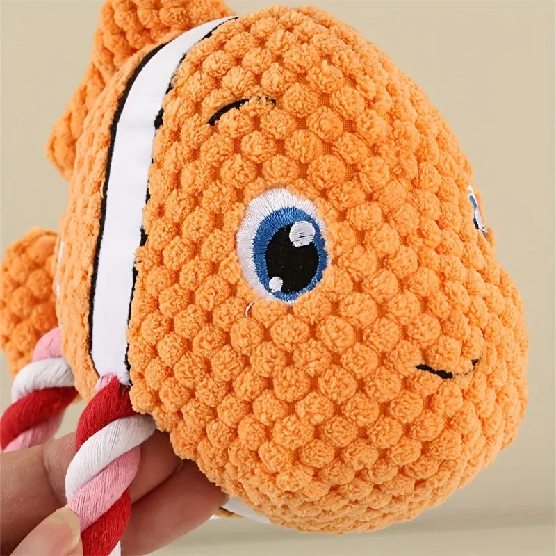 Turtle-shaped plush dog chew toy with knotted texture and squeaker inside