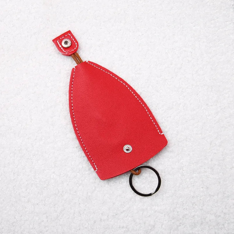 Cartoon PU leather pull-out car key case measuring 14 x 7.5cm with colourful designs