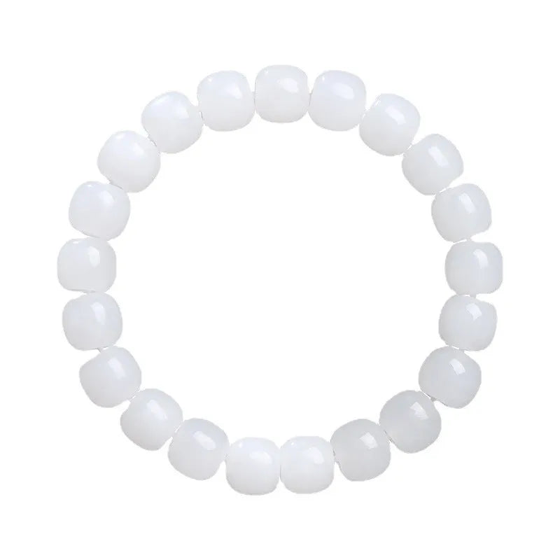 White Hetian jade barrel bead bracelet for men and women on a neutral background.