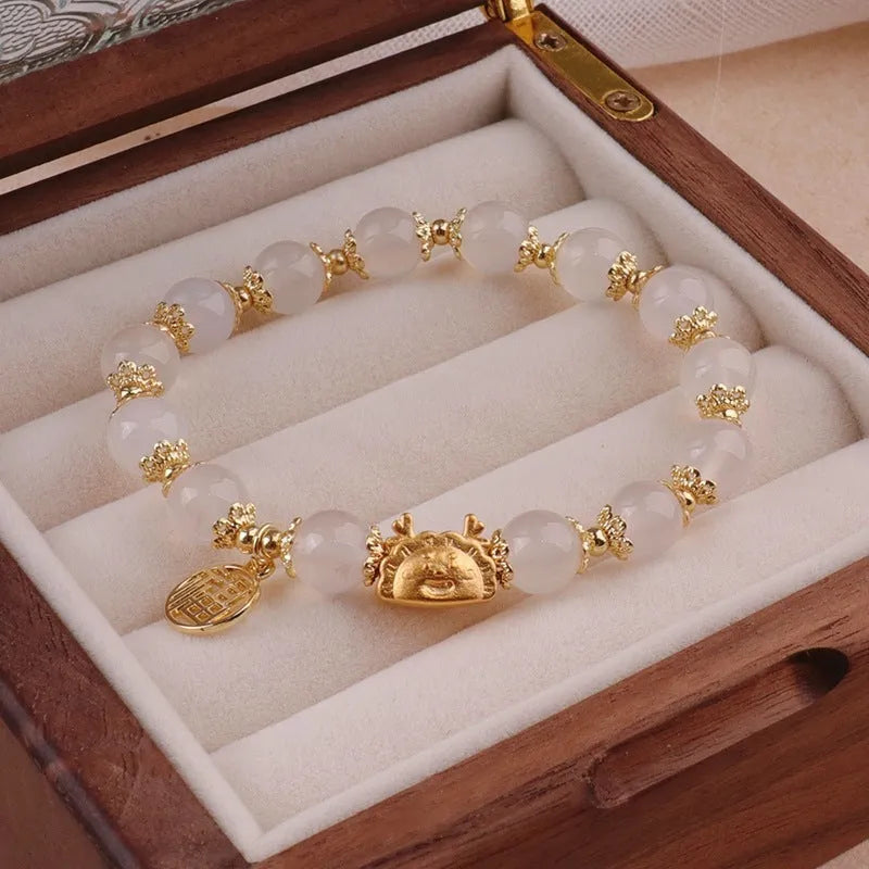 Floral glazed zodiac animal bracelet for women with coloured glass beads in red, pink, and white pearl colour variations